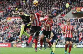  ??  ?? Olivier Giroud jumps highest to head in his second goal for Arsenal at the Stadium of Light