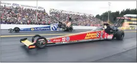  ?? MEDIANEWS GROUP FILE PHOTO ?? Brittany Force, front, holds off the challenge of Leah Pritchett to become top qualifier in Top Fuel Saturday, Sept. 14, 2019, at Maple Grove.