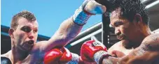  ??  ?? Jeff Horn, left, battles Manny Pacquiao in Brisbane in July.