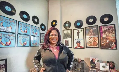  ?? EBONY COX / MILWAUKEE JOURNAL SENTINEL ?? Antonia Anderson poses for a portrait in her hip-hop museum in her Milwaukee apartment. She estimates she has upward of 6,000 hip-hop pieces.