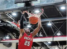  ?? MARC LAFLEUR CARLETON UNIVERSITY ?? Brock’s Jevon Brown dunks the ball in men’s university basketball versus Carleton Wednesday night in Ottawa. The Badgers took down the Ravens to advance to the quarterfin­als against the Ottawa Gee-Gees.