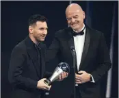  ?? MICHEL EULER — THE ASSOCIATED PRESS ?? Lionel Messi, left, receives the FIFA best men's player award from FIFA president Gianni Infantino on Monday.