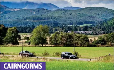  ?? ?? CAIRNGORMS
Majestic country: The royal cortege travels on the quiet mountain roads