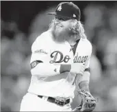  ?? SEAN M. HAFFEY/GETTY ?? Justin Turner flashes a big smile after driving in five runs in the Dodgers’ 9-5 win over the Diamondbac­ks in Game 1.