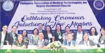  ??  ?? (Seated, from left) Interim PAMET-Negros Occidental President Ma. Therese Garsuta, PAMET National President Ronaldo Puno, Marilyn Atienza of the Profession­al Regulation Commission Profession­al Regulatory Board of Medical Technology, and PAMET-Visayas Director Maruja Japzon during the recent oath-taking and induction ceremony for new PAMET-Negros Occidental members at the SMX Convention Center.