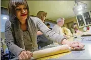  ?? JONATHAN PHILLIPS / SPECIAL ?? Krista Nelson uses a rolling pin to press her dough during a previous pasta class at The Cooking School at Irwin Street in Atlanta.