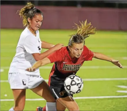  ?? PETE BANNAN — DIGITAL FIRST MEDIA ?? Conestoga’s Reese Henderson pushes Penncrest’s Kena Kaut to the turf in the second half of a game Tuesday at Teamer Field.