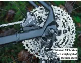  ?? ?? Shimano XT brakes are a highlight of the spec sheet