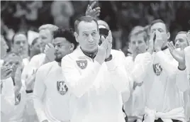  ?? GERRY BROOME AP ?? Surrounded by former players, Duke coach Mike Krzyzewski is honored Saturday prior to the game against rival North Carolina, Krzyzewski’s final game at Cameron Indoor Stadium. The visiting Tar Heels beat the Blue Devils 94-81.