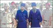  ?? HT PHOTO ?? Terror suspects Sher Singh and Mann Singh being produced in court by police in Ajnala on Monday.