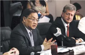  ??  ?? METRO PACIFIC Investment­s Corp. (MPIC) Chairman Manuel V. Pangilinan (left) and MPIC Chief Finance Officer David J. Nicol presided over a press briefing ahead of the company’s analysts conference in a building of the Philippine Long Distance Telephone...