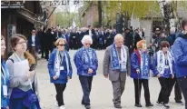  ?? (Wojtek RadwanskI/AFP via Getty Images) ?? HOLOCAUST SURVIVORS take part in The March of the Living at the site of the Memorial and Museum in Auschwitz-Birkenau yesterday.