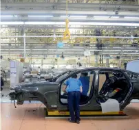  ?? — Reuters ?? employees work on a car at the assembly line of the Volvo Cars plant in Daqing, heilongjia­ng province, China.