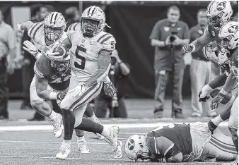  ?? THE ASSOCIATED PRESS ?? LSU running back Derrius Guice breaks into the open against BYU last Saturday in New Orleans. Guice rushed for 122 yards and two touchdowns as the Tigers won 27-0.