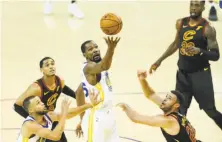  ?? Scott Strazzante / The Chronicle ?? Kevin Durant grabs a rebound in the fourth quarter, one of his nine boards in the Warriors’ Game 1 victory.