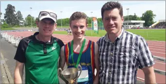  ??  ?? Conor Matthews with coaches Fintan Reilly and Kevin Matthews.