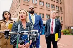  ?? Tasos Katopodis / Getty Images ?? Rep. Marjorie Taylor Greene, R-Ga., talks to the media with Rep. Anna Paulina Luna, R-Fla., Rep. Byron Donalds, R-Fla., and Rep. Mike Collins, R-Ga., after she lead a tour of the jail where Jan. 6 defendants are being held in Washington.