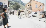  ?? PICTURE: AP. ?? DISASTER: A woman looks at the rubble of a building a day after a 4.0-magnitude quake hit Ischia, near Naples, Italy.