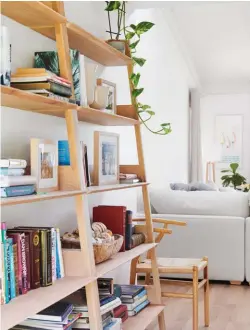  ??  ?? ABOVE LEFT The light-filled living area at Tara’s Mornington Peninsula weekender features a modular sofa and oak shelves from Coastal Living. The cork tray/basket (with shells) is a souvenir from a holiday in St Tropez, France. Floor lamp, Provincial Home Living.