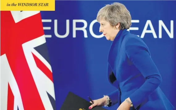  ?? EMMANUEL DUNAND / AFP / GETTY IMAGES ?? U.K. Prime Minister Theresa May leaves after a press conference following a special meeting of the European Council to endorse the draft Brexit agreement in Brussels on Sunday. The European Union’s top official urged British lawmakers to ratify the Brexit deal May has negotiated with European leaders, warning that it will not be modified.