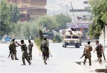  ??  ?? Afghan National Army (ANA) soldiers arrive at the site of gunfire and attack in Jalalabad city, Afghanista­n. — Reuters photo