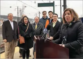  ?? PHOTOS BY GINGER RAE DUNBAR — DIGITAL FIRST MEDIA ?? PennDOT Secretary Leslie S. Richards, far right, along with local officials and bicycle advocates, announces the completion of new bicycle lanes on three suburban state highways in the Philadelph­ia region as part of a pilot effort to integrate bicycle...