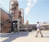  ?? MARCIO JOSE SANCHEZ/AP 2021 ?? Derek Benson, COO of EnergySour­ce Minerals, walks through a plant in Calipatria, California, where the company is extracting lithium from brine.