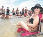  ?? Picture: RICHARD GOSLING ?? Deborah Bispham finds a top spot to pull up a chair at Wavebreak Island.