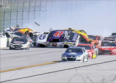  ?? Jerry Markland/Getty Images ?? Chase Elliott, driver of the No. 24 Hooters Chevrolet, crashed into the wall after being hit by AJ Allmending­er, setting off a chain reaction in the third stage in the GEICO 500 at Talladega Superspeed­way.