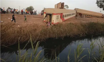  ?? Photograph: Khaled Elfiqi/EPA ?? Carriages of the passenger train which came off the track north of Cairo.