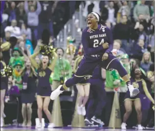  ?? The Associated Press ?? FINAL MOMENT: Notre Dame’s Arike Ogunbowale celebrates after making the game-winning basket in overtime against UConn Friday in the Final Four of the NCAA Tournament in Columbus, Ohio. Notre Dame won, 91-89, to advance to today’s final against...