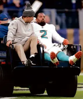  ?? ROB CARR/GETTY IMAGES ?? The Dolphins lost pass rusher Bradley Chubb to a seasonendi­ng ACL tear late in Sunday’s blowout loss to the Ravens.