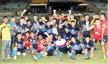  ??  ?? Beaufort officials and players are all smiles after they beat Keningau 5-3 on penalties at the Likas Stadium, yesterday. They face Kota Kinabalu in the final of the inter-district football tournament tomorrow for a shot at lifting the Chief Minister...