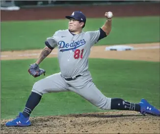  ?? DODGERS ROOKIE Robert Gauthier Los Angeles Times ?? Victor González pitched the seventh inning in Game 5, giving up one run. He’s among several f irst- year players who have thrived at times in near- empty, neutral- site parks.