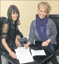  ?? SUBMITTED PHOTO ?? Shelley Bennett Trifos, left, and Coralie Murphy, developer of the Journey Alive program, go over plans for the upcoming fall sessions that are slated to begin Sunday at 7 p.m. at Our Lady of Fatima Church hall.
