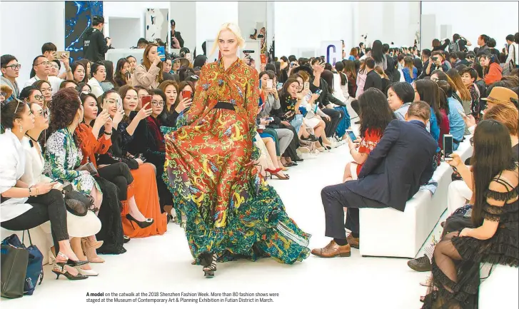  ??  ?? A model on the catwalk at the 2018 Shenzhen Fashion Week. More than 80 fashion shows were staged at the Museum of Contempora­ry Art &amp; Planning Exhibition in Futian District in March.