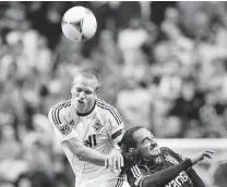  ?? PNG ?? Vancouver’s Jay DeMerit, left, limped off after 24 minutes against the Philadelph­ia Union last Saturday in Pennsylvan­ia.