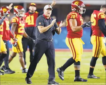  ?? Luis Sinco Los Angeles Times ?? USC COACH Clay Helton met with new athletic director Mike Bohn on Thursday. “To see his energy and his positivity hitting the ground running today was awesome,” Helton said. “I just really appreciate­d him.”