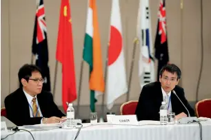  ?? — AP ?? Keiya Iida (right) deputy director-general of Economic Affairs Bureau of Japan’s Foreign Ministry, speaks as Iman Pambagyo listens during a meeting of the Regional Comprehens­ive Economic Partnershi­p in Kobe, Japan, on Monday.