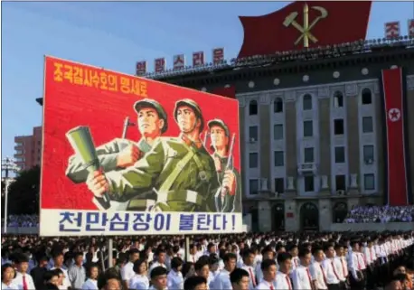  ?? JON CHOL JIN — THE ASSOCIATED PRESS ?? Tens of thousands of North Koreans gathered for a rally at Kim Il Sung Square carrying placards and propaganda slogans as a show of support for their rejection of the United Nations’ latest round of sanctions on Wednesday in Pyongyang, North Korea.