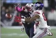  ?? CHARLES KRUPA - THE ASSOCIATED PRESS ?? New England Patriots defensive back J.C. Jackson, left, breaks up a pass intended for New York Giants wide receiver Darius Slayton in the second half of an NFL football game, Thursday, Oct. 10, 2019, in Foxborough, Mass.