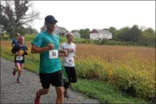  ?? DIGITAL FIRST MEDIA FILE PHOTO ?? People participat­e in a previous 5K trail run in Upper Pottsgrove as part of a celebratio­n and grand opening for Althouse Arboretum, the centerpiec­e of the township’s open space efforts.