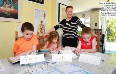 ?? PHOTO: FRANK MCGRATH ?? Busy at work: Cliodna Gilroy with her children, Oisín (10), Isla (4) and Ailish (7), at their home at Ard Na Greine in Dublin.