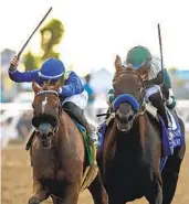  ?? BENOIT PHOTO ?? Adare Manor and jockey Juan Hernandez (right) keep Desert Dawn (Umberto Rispoli) at bay to win the Grade I, $400,000 Clement L. Hirsch Stakes.