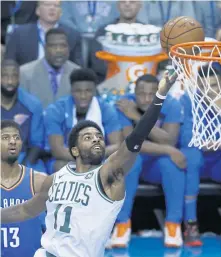  ?? ASSOCIATED PRESS ?? UP AND IN: Kyrie Irving goes to the basket during the Celtics’ win in Oklahoma City.