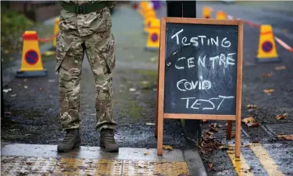  ?? Photograph: Christophe­r Furlong/Getty Images ?? A soldier at a coronaviru­s testing centre set up at the Merseyside Caribbean Council Community Centre on in Liverpool.