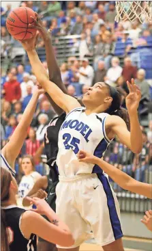  ?? Jeremy Stewart / Rome News-Tribune ?? Model center Victaria Saxton (25) reaches for a rebound against Bryan County’s Jay Black during Tuesday’s game.