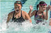  ?? PHOTO: DOUG FIELD/STUFF ?? Temuka youngsters Kiya Hogg, 11, and Natalie Holland, 9, cool off at Temuka Summer Pool.