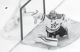  ??  ?? Dallas Stars goaltender Anton Khudobin (35) makes a save against the Tampa Bay Lightning during a 4-1 win Saturday in Game 1 of the Stanley Cup Final in Edmonton, Alberta. [JASON FRANSON/THE CANADIAN PRESS VIA AP]