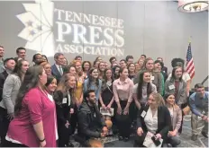 ??  ?? Tennessee Gov. Bill Lee poses with college students after speaking to the Tennessee Press Associatio­n in Nashville last Thursday. MARK RUSSELL / THE COMMERCIAL APPEAL